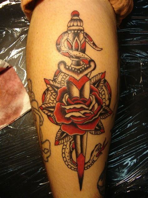 The black rose tattoo is a rare and quite different art work. Beautiful black red dagger with rose and snake tattoo on ...