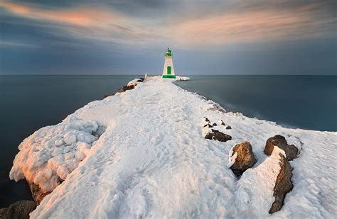 The Lighthouse In A Winter Sunset Photograph By Li Jian