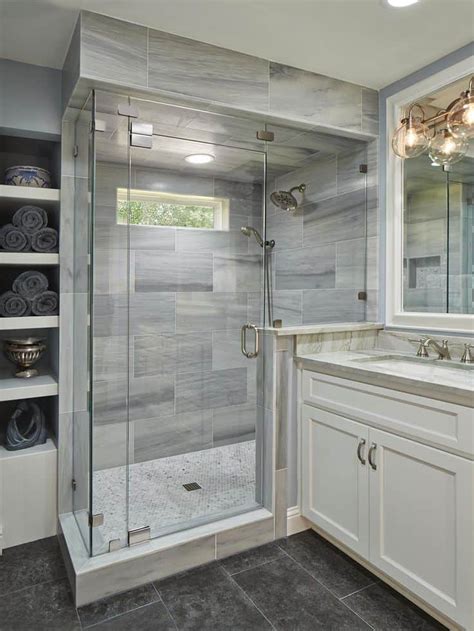 Nearly colorless but unmistakably pristine white, the illusion of space is achieved by being minimalist and embracing contrasting metallic fixtures like the mammoth rain shower head for superior water flow. These 20 Tile Shower Ideas Will Have You Planning Your ...