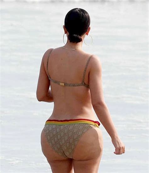 Kim Kardashian Looks Bootylicious In Barely There Bikini While Sister