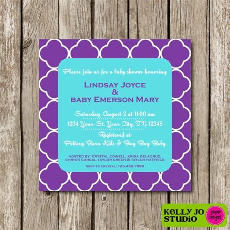 The Purple And Blue Baby Shower Is Displayed On A Wooden Background