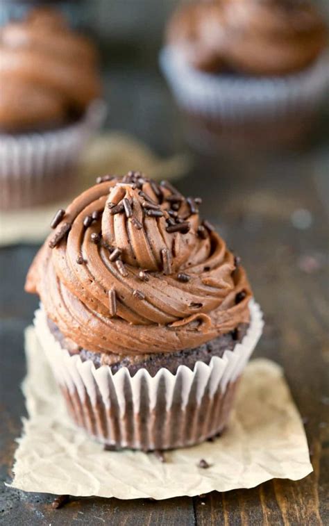 Beat cream cheese and butter in large bowl with electric mixer on medium speed until well blended. Chocolate Buttercream Frosting on a chocolate cupcake on a ...