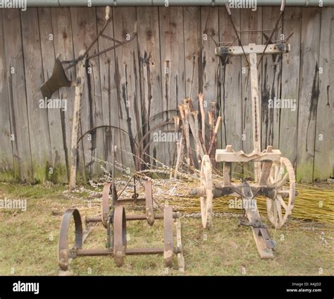 Traditional Agricultural Tools In Front Of The Wooden Barn Lipnica