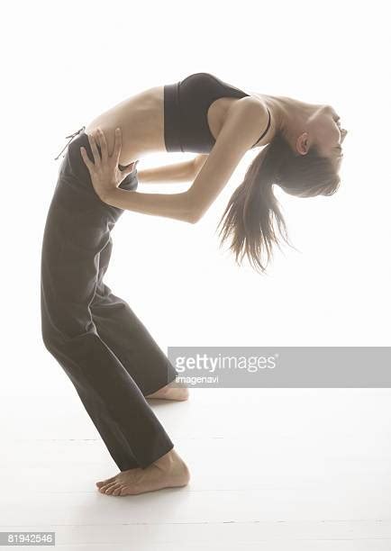 Side Profile Of A Woman Bending Over Backwards Photos And Premium High
