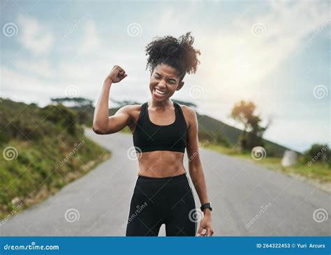 Strong Is A Mindset An Attractive Young Sportswoman Flexing Her Bicep