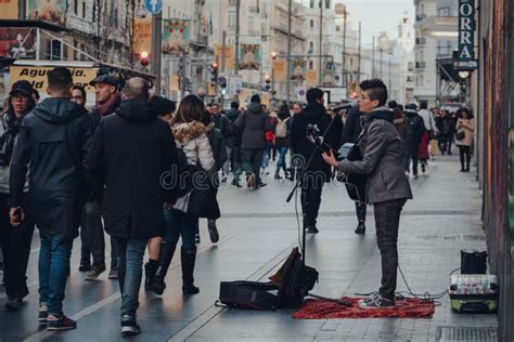 Busker Singing And Playing Guitar On Gran Via Street In Madrid Spain