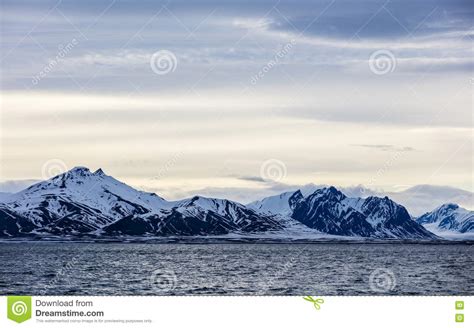 Clouds Over Snowy Mountains In The Arctic Stock Photo Image Of