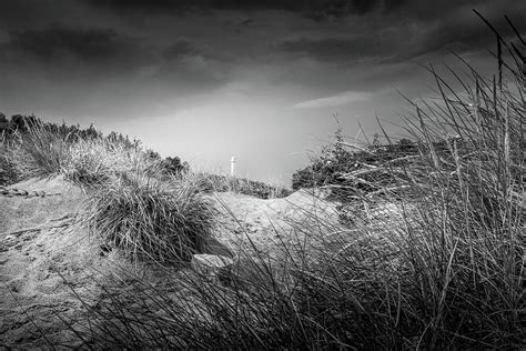 old lighthouse through the sand dunes photograph by nicklas gustafsson pixels