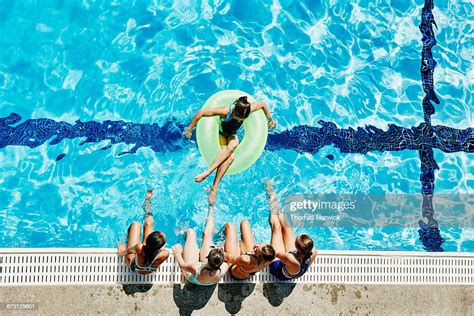 Group Of Girls Hanging Out Together At Pool Photo Getty Images