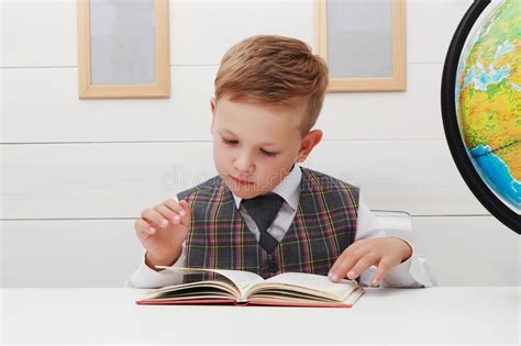 Child With Book Handsome Little Boy In A School Uniform Teaches