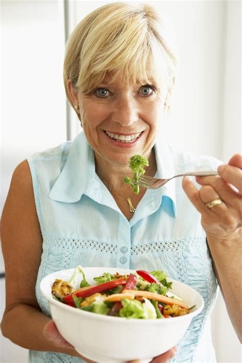 Middle Aged Woman Eating Healthy Salad Stock Photo Image Of Enjoying