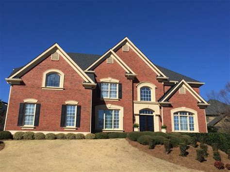 And michael loves the stones! help selecting Paint for stucco & Trim for Red/Orange Brick