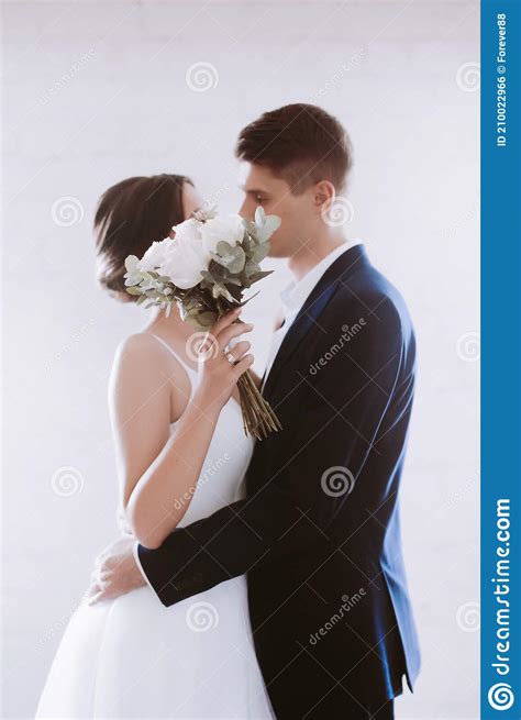 Portrait Of Beautiful Young Couple On Their Wedding Day Stock Photo