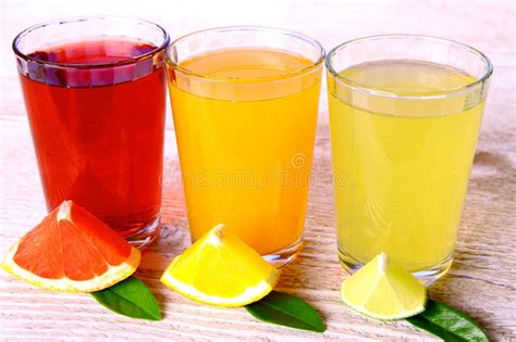 Citrus Juices In Glass From Grapefruit Oranges Lime Stock Photo