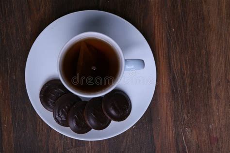 Image Of Ivory Tea Cup With Sweet Heart Shaped Cookie Stock Image