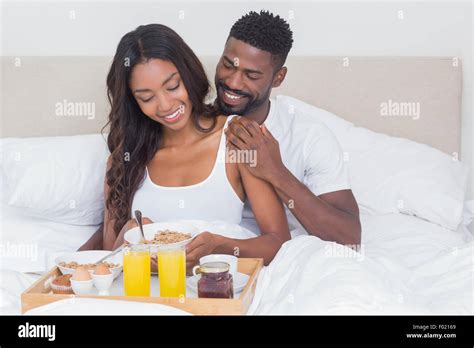 Relaxed Couple Having Breakfast In Bed Together Stock Photo Alamy