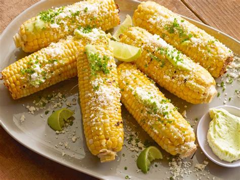 The corn is opened on the husk just a little. Grilled Corn on the Cob with Garlic Butter, Fresh Lime and ...