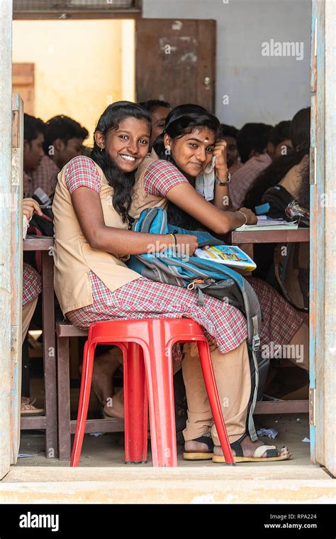 2 Two Young Teenage Indian Girls Smile And Pose For The Camera During