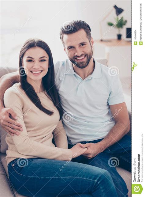 Portrait Of Young Handsome Man Embracing His Cute Girlfriend At Stock