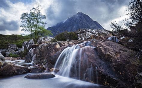 Waterfall On River Coupal And Mountain Buachaille Etive Mor In Glen Coe
