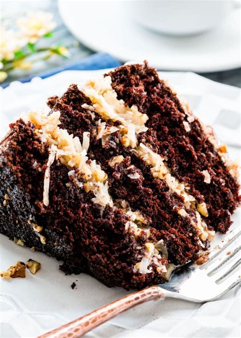 This german chocolate cake recipe, from scratch, is decadent and sweet with the rich chocolate cake layers topped with coconut pecan frosting! Pin on Blogger Recipes We Love
