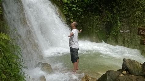 Man Standing Facing Waterfalls · Free Stock Photo