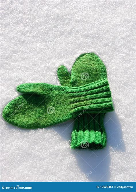 Pair Of Green Mittens On Snow Stock Image Image 12628461