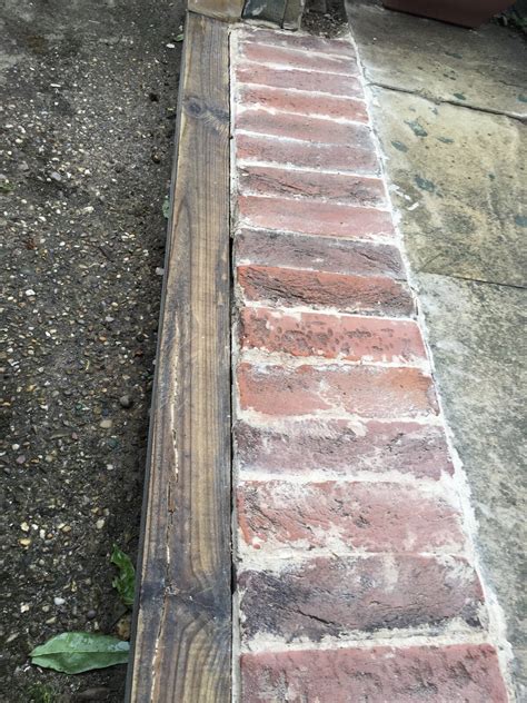 I am not going to paint or stain over this filler,just gluing my finish planking down. Filling a gap between wood and brick? | DIYnot Forums