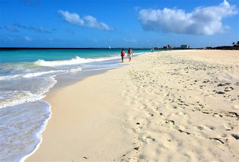 Couple Strolling Manchebo Beach Near Oranjestad Aruba Encircle Photos