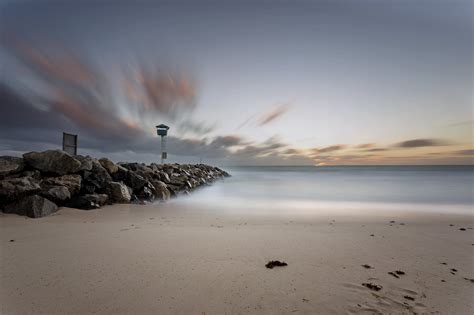 Coastal Rocks On Calm Sea Under White And Blue Sky City Beach Hd