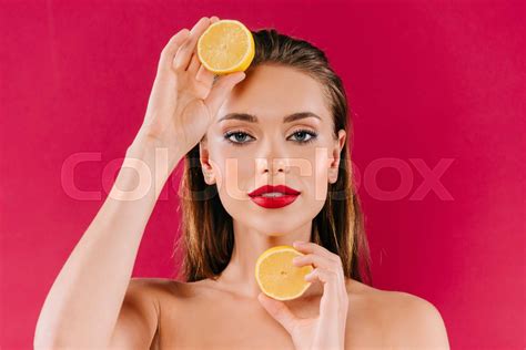 Nude Beautiful Woman With Red Lips Holding Orange Halves Isolated On