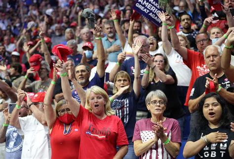 crowd gathers for tulsa rally donning president trump gear amid national guard presence
