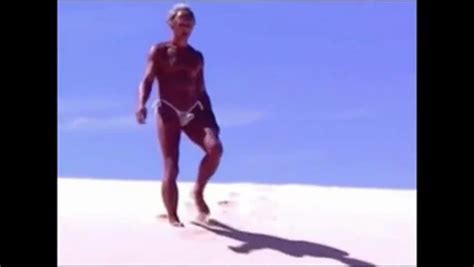Tanned Guy On Beach In Tiny String Thong Temporarily