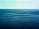 A Small Boat In The Ocean Images