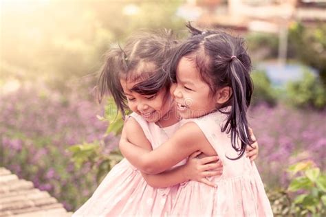 186 Child Two Happy Little Girls Hug Each Other Love Stock Photos