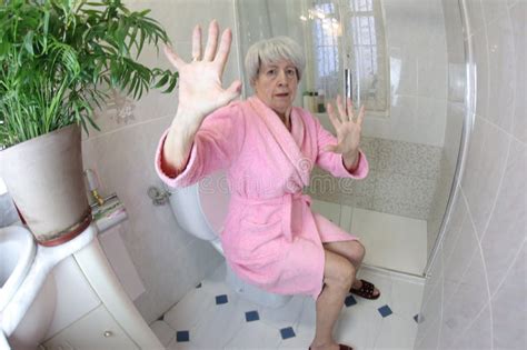 Senior Woman Feeling Embarrassment After Being Caught In The Toilet