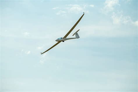 The Glider Gliding In The Blue Sky Glider Flight Stock Photo Download