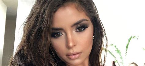 Demi Rose Squeezes Her Colossal Chest In Tiny Top With Feathers