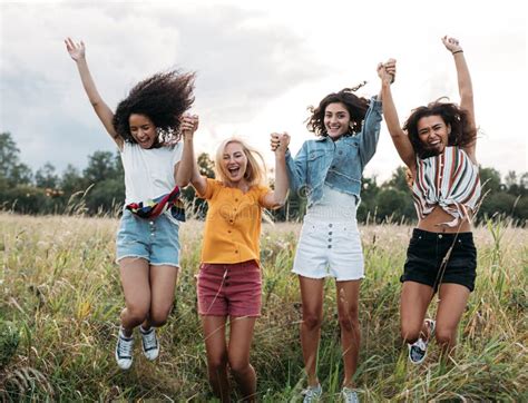 Group Of Diverse Women Jumping Together Outdoors Friends Having Fun