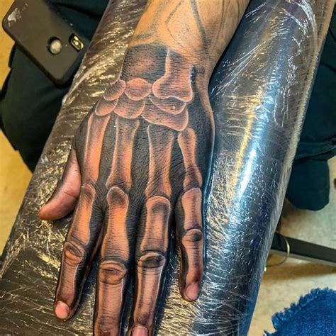 50 Meaningful Hand Tattoo Ideas For Men Symbols Of Strength