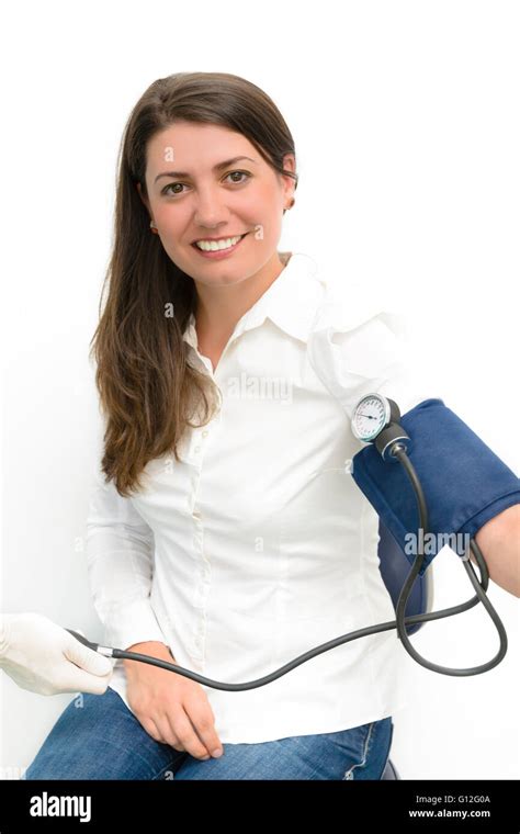 Beautiful Young Woman Using Blood Pressure Measurement Device