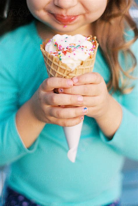Cute Young Girl Eating A Big Ice Cream By Stocksy Contributor Jakob Lagerstedt Stocksy