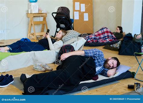 Young Tired Man Sleeping Under Blanket While Lying On Mattress On The Floor Stock Image Image