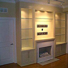 Custom Built-ins Flanking the Fireplace with Glass by Best ...