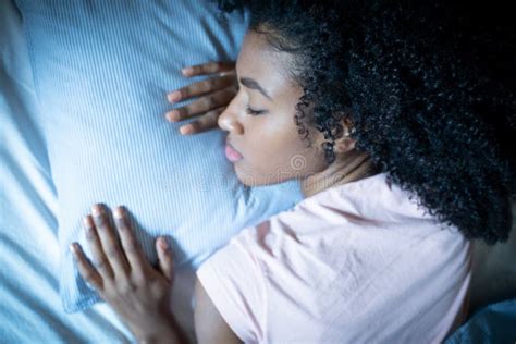 Healthy Young African Girl Sleeping In Comfortable Bed Stock Image