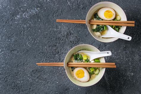 Stirring eggs into simmering broth is a classic technique for adding nourishment and body to soup. Asian Soup With Eggs, Onion And Spinach Stock Photo ...