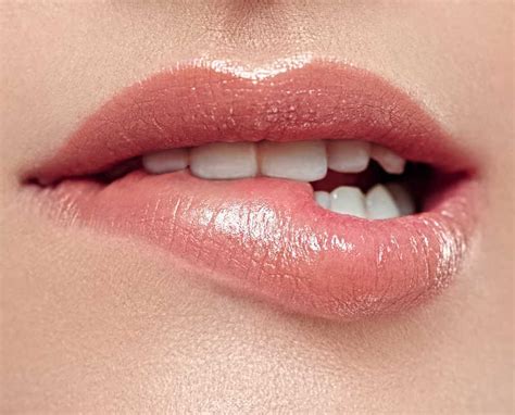 Lip Biting Meaning Causes Symptoms Images Bumps Swollen Lip From