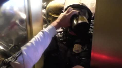 disturbing video shows officer crushed against door by mob storming the capitol cnn