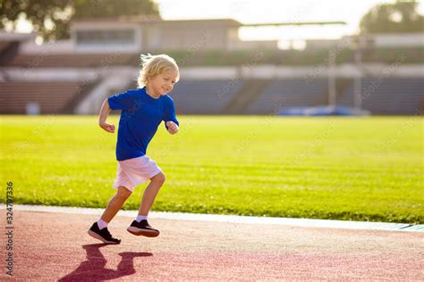 Child Running In Stadium Kids Run Healthy Sport Stock Photo Adobe