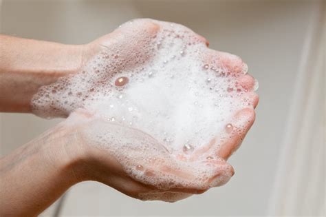 Soap Foam In Female Hands Premium Photo